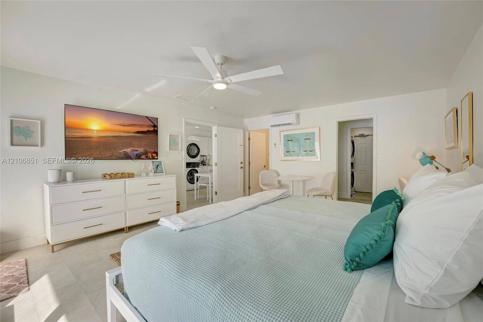1319 SW 30th Street, #B, Fort Lauderdale, Fort Lauderdale, FL 33315 Room featuring neutral tile flooring, a multi-blade ceiling fan with integrated light fixture, and a wall-mounted ductless air conditioning unit