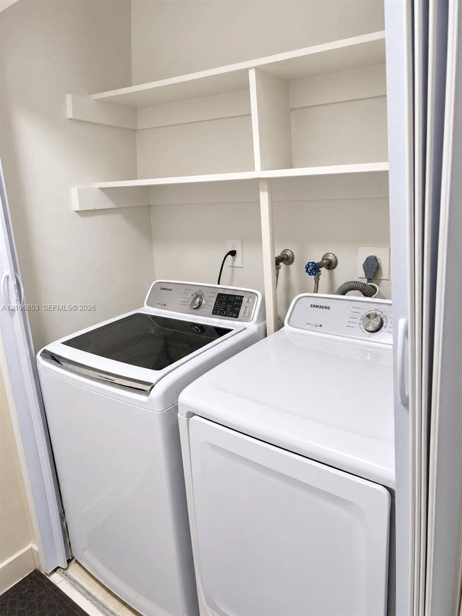 6331 Pinehurst Circle W, #C35, Tamarac, FL 33321 Built-in white shelving, dedicated appliance hookups, and bi-fold closet doors