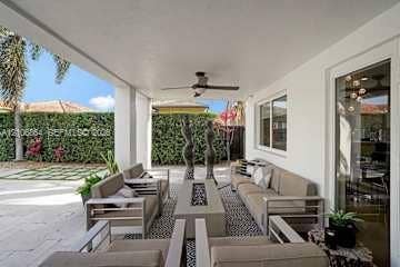 885 SW 144th Avenue, Miami, FL 33184 Covered outdoor living space featuring a smooth ceiling, recessed lighting, a ceiling fan, and stone-finish flooring