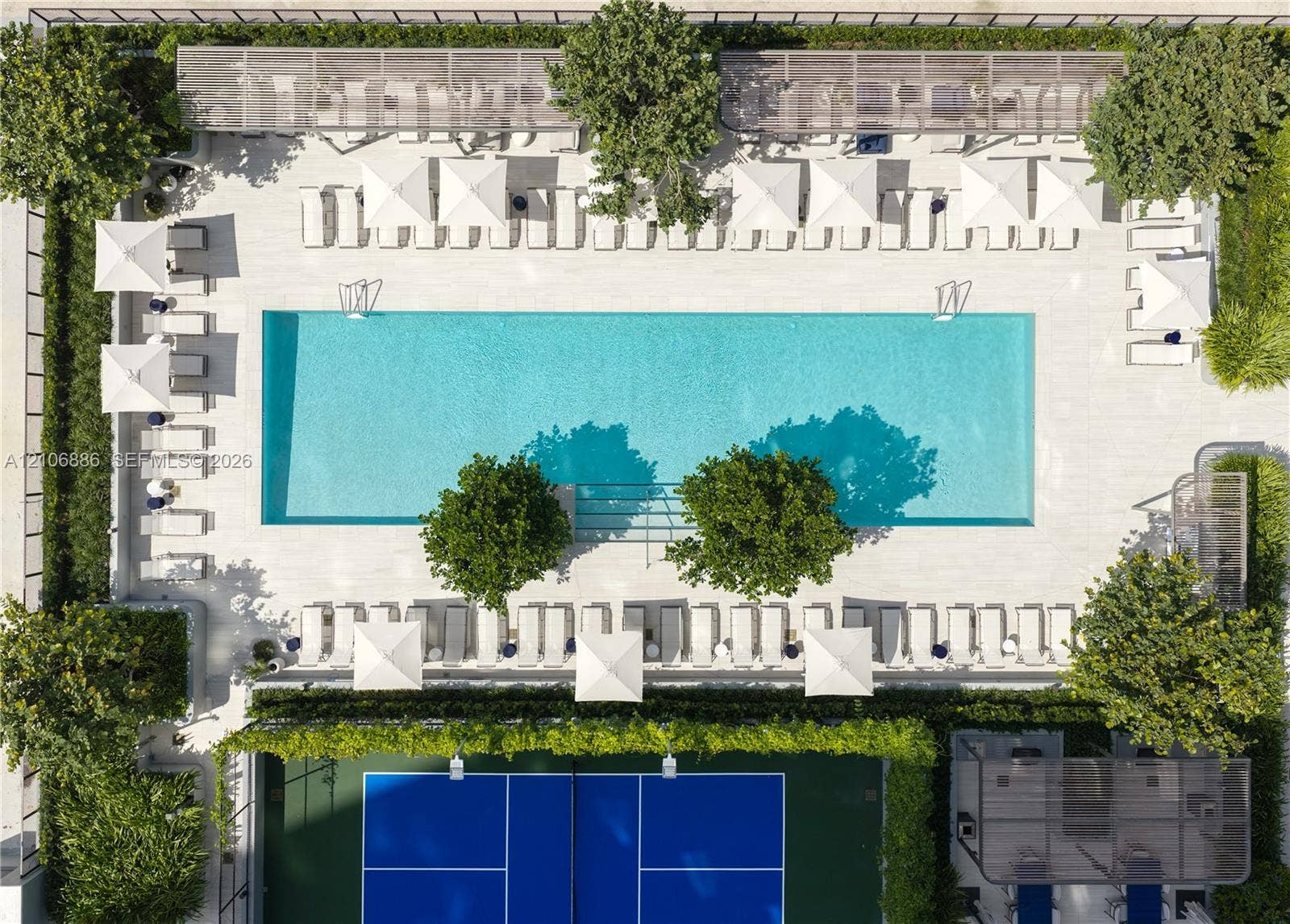 1400 Biscayne Boulevard, #2603, Miami, FL 33132 Rectangular swimming pool with tiled surround, pickleball court with hard surface, and perimeter landscaping