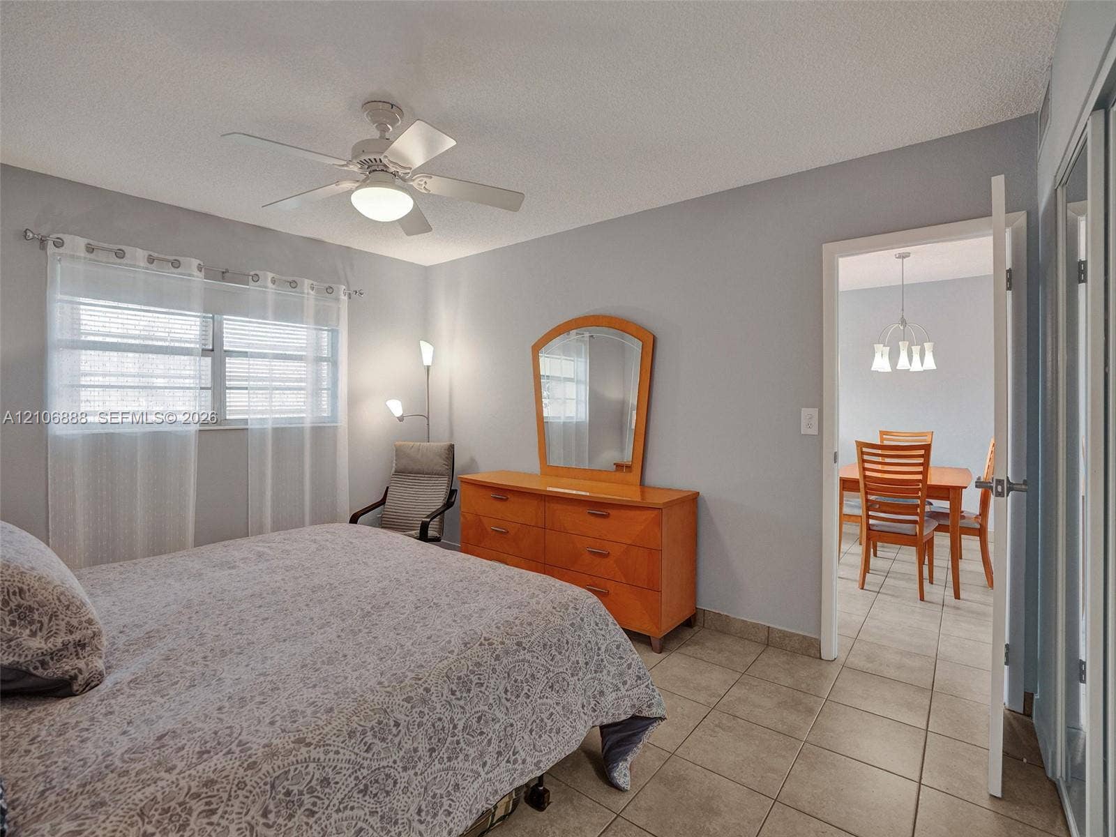 3506 NW 49th Avenue, #508, Lauderdale Lakes, FL 33319 Room featuring ceramic tile flooring, a white ceiling fan with integrated lighting, and horizontal blinds