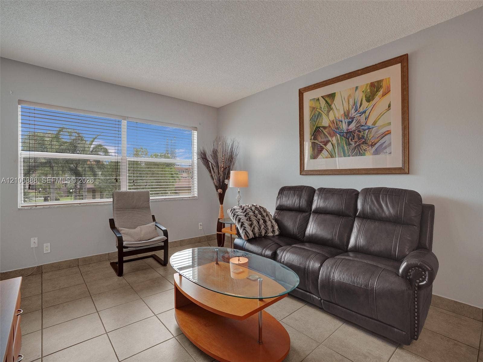 3506 NW 49th Avenue, #508, Lauderdale Lakes, FL 33319 Large window with horizontal blinds and neutral ceramic tile flooring