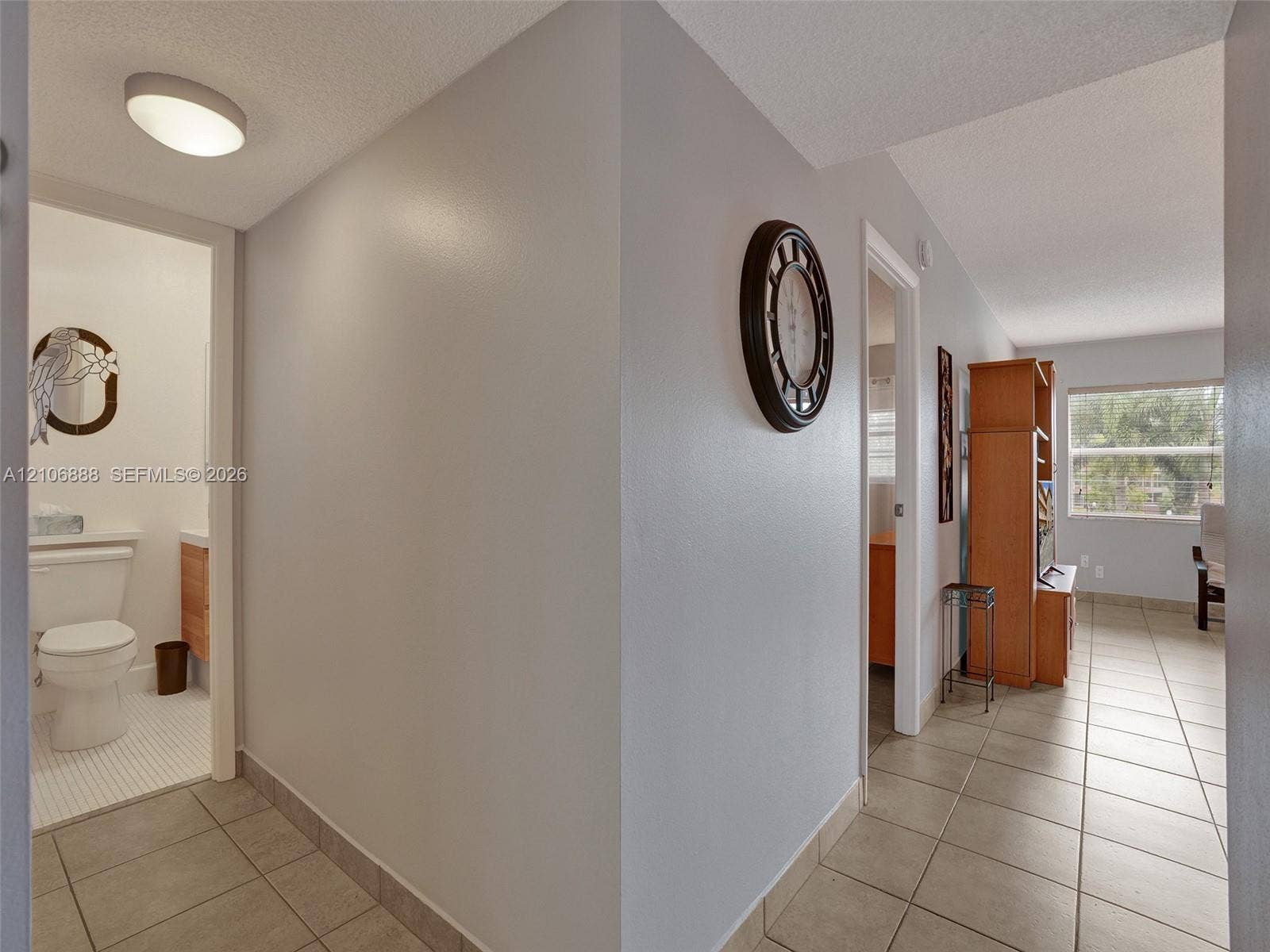 3506 NW 49th Avenue, #508, Lauderdale Lakes, FL 33319 Neutral interior featuring ceramic tile flooring, a flush-mount ceiling light fixture, and a white porcelain toilet