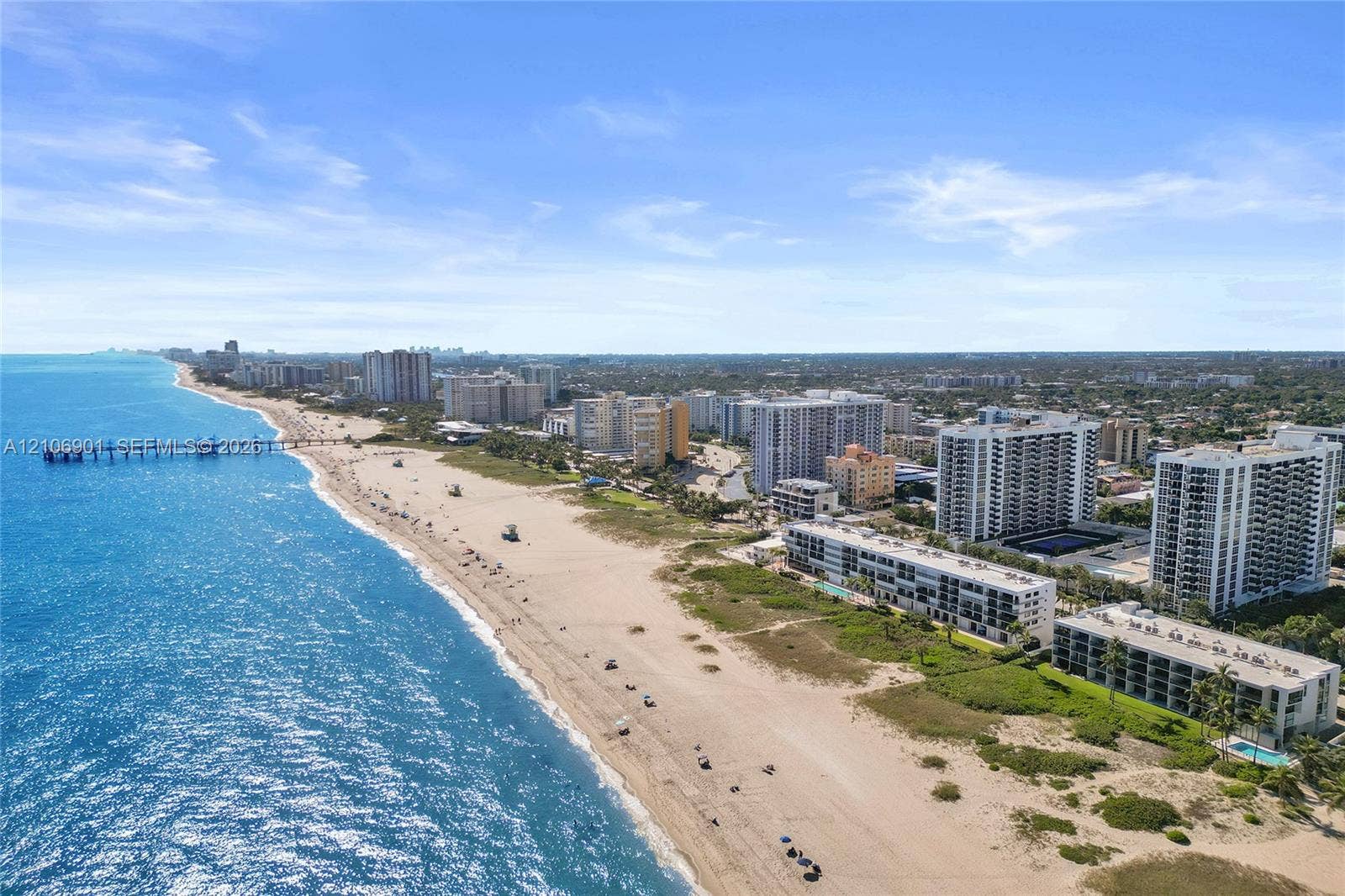 510 N Ocean Boulevard, #308, Pompano Beach, FL 33062 Coastal aerial perspective featuring expansive sandy shoreline, turquoise ocean waters, and regional cityscape