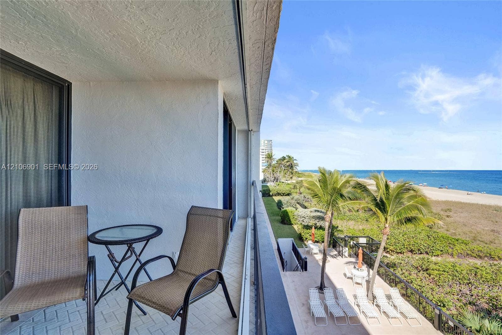510 N Ocean Boulevard, #308, Pompano Beach, FL 33062 Covered balcony featuring herringbone-patterned flooring and direct oceanfront exposure