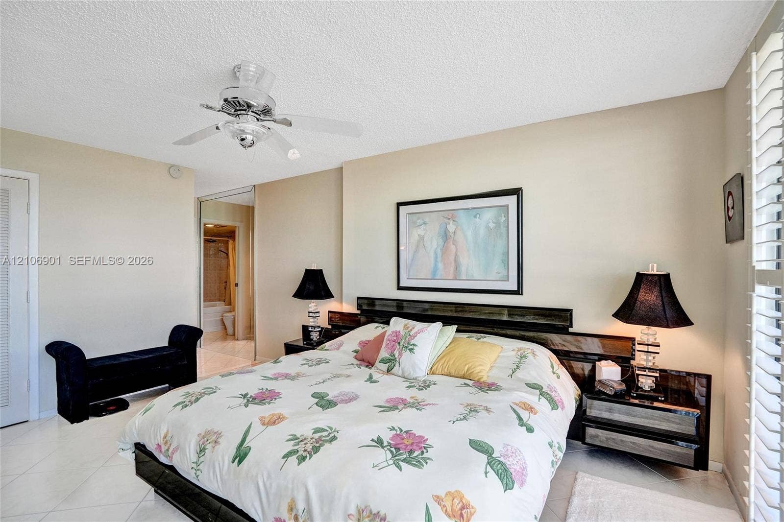 510 N Ocean Boulevard, #308, Pompano Beach, FL 33062 Interior space featuring tiled flooring, a ceiling-mounted light fixture with fan, and adjustable window shutters