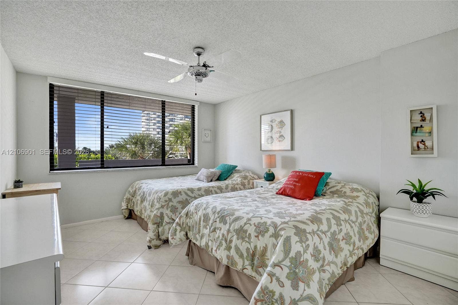 510 N Ocean Boulevard, #308, Pompano Beach, FL 33062 Large windows, tile flooring, and a ceiling-mounted light fixture with fan
