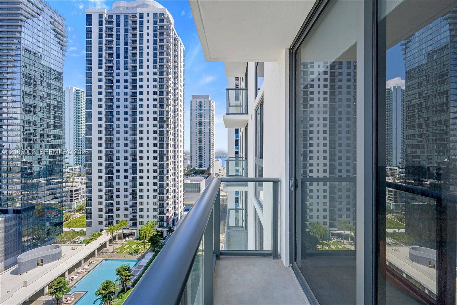 11 NE 6th Street, #1111, Miami, FL 33132 Private balcony featuring a glass-panel railing and sliding glass door access