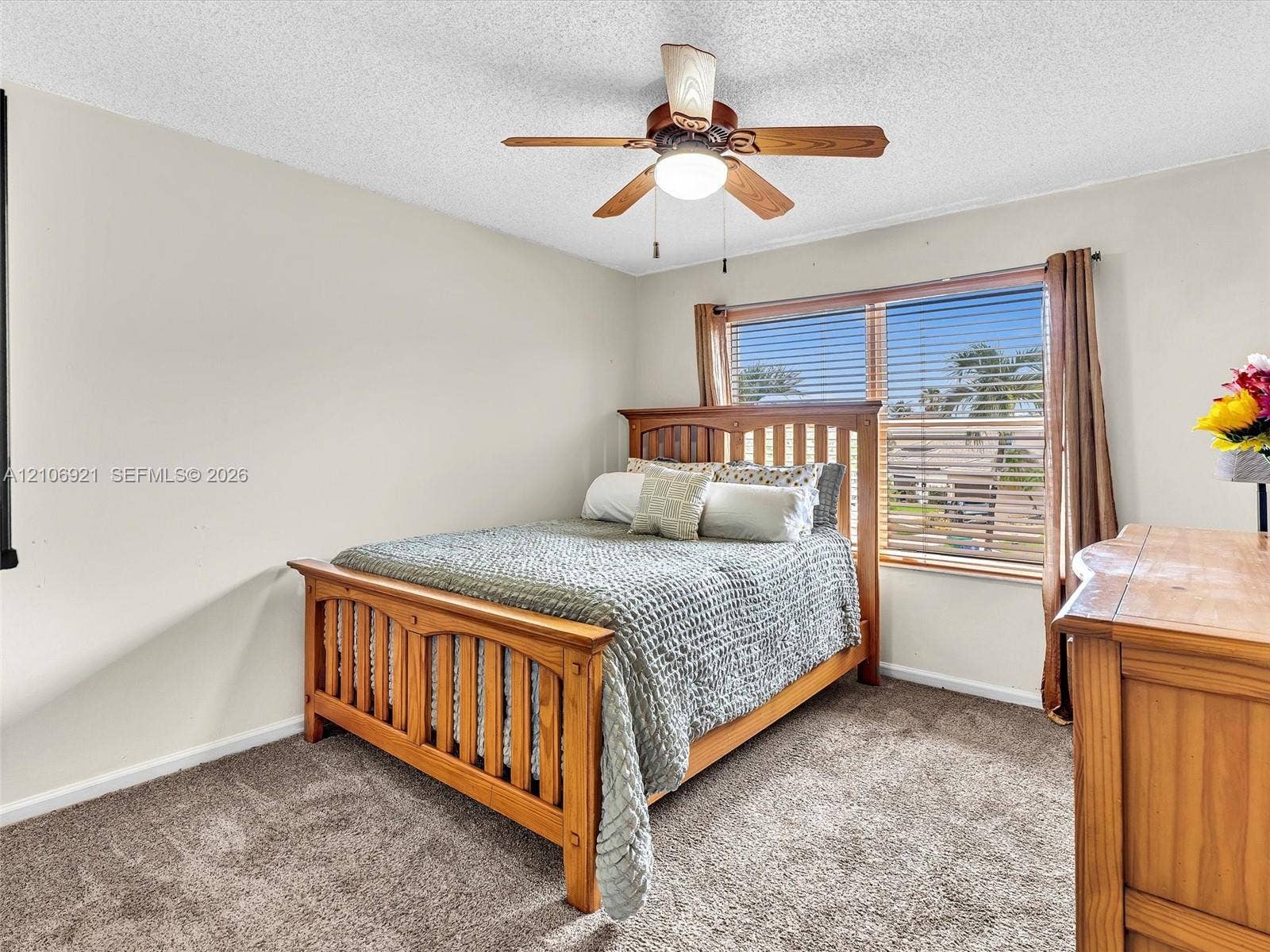 Bedroom 4 carpeted flooring, window with horizontal blinds, and ceiling fan with integrated lighting