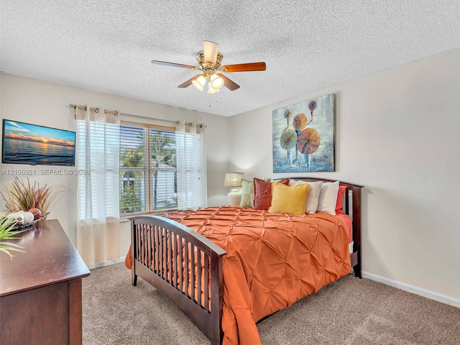 Bedroom 2 ceiling fan with three-light fixture, and neutral wall tones