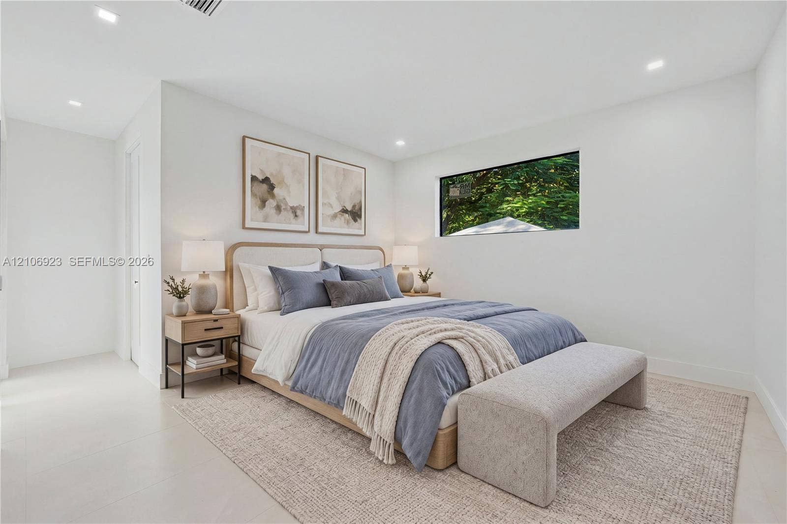 870 Superior Street, Opa Locka, FL 33054 Neutral-toned interior featuring recessed ceiling lighting, light-colored tile flooring, and a horizontal rectangular window