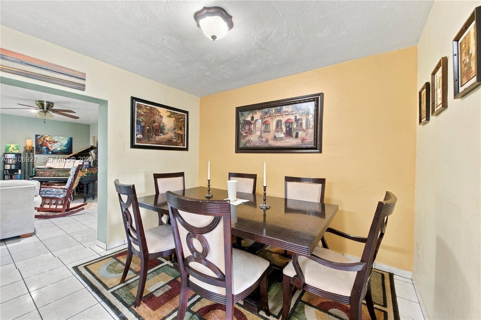 Dining area featuring ceramic tile flooring, a central flush-mount ceiling light fixture, and neutral wall paint