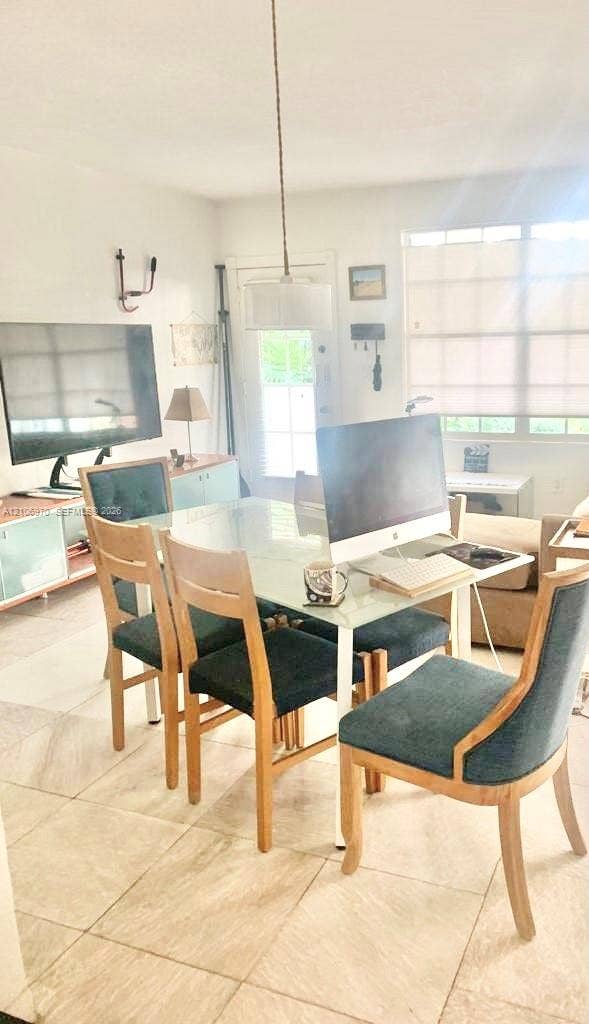 8540 Byron Avenue, #1B, Miami Beach, Miami Beach, FL 33141 Large-format tile flooring, pendant lighting fixture, and window with built-in shades