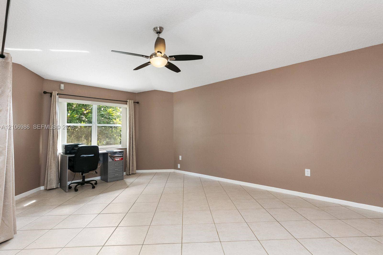 3801 SW 147th Avenue, Miramar, FL 33027 Room featuring large-format diagonal tile flooring, neutral wall paint, and a ceiling-mounted fan with integrated lighting