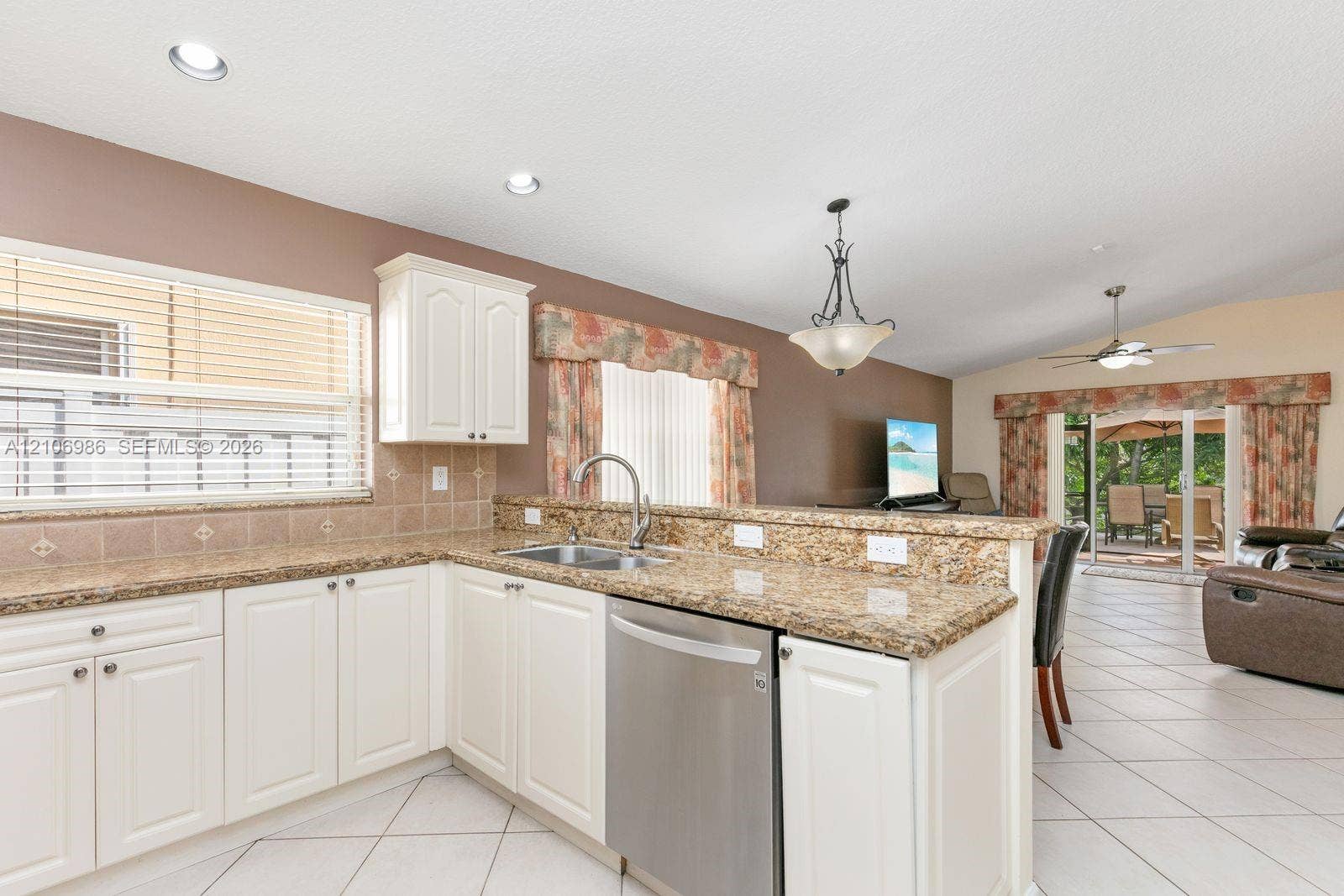 3801 SW 147th Avenue, Miramar, FL 33027 Kitchen featuring white cabinetry, stone-surface countertops, tile flooring, recessed lighting, and a stainless steel dishwasher