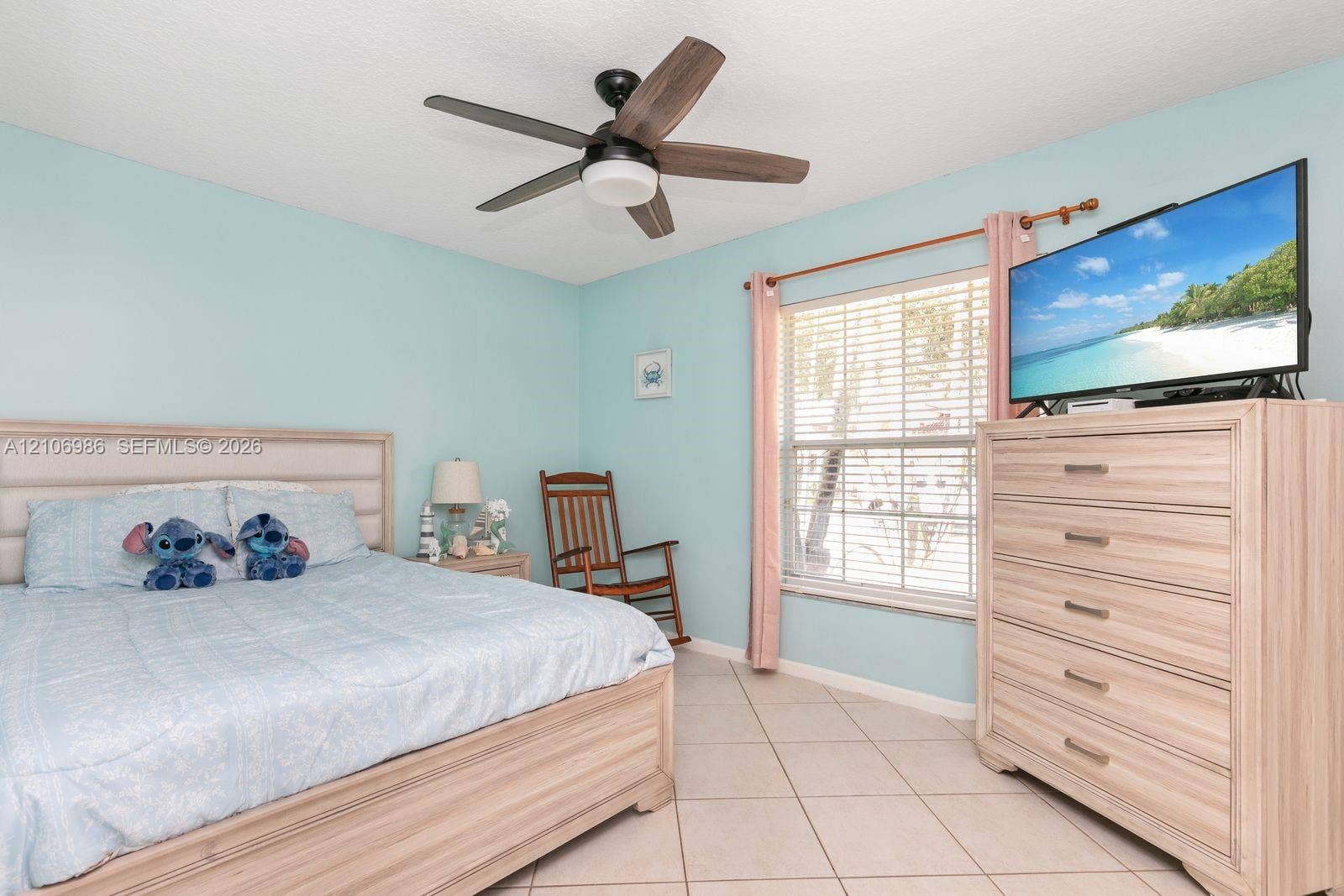 3801 SW 147th Avenue, Miramar, FL 33027 Neutral-toned tile flooring, horizontal window blinds, and a multi-blade ceiling fan with integrated lighting