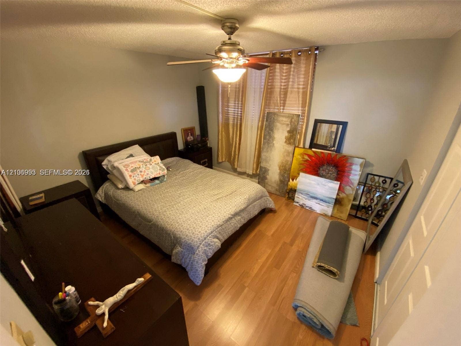 410 NW 68th Avenue, #515, Plantation, Plantation, FL 33317 Wood-finish flooring, ceiling fan with integrated lighting, and multi-panel closet doors