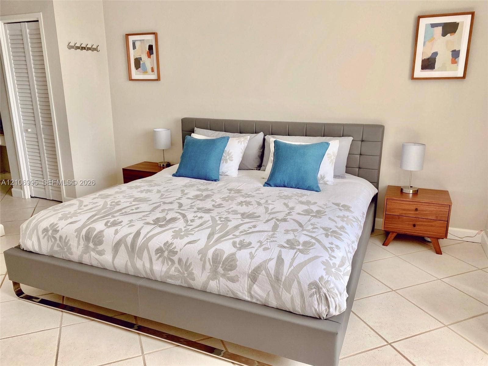 3505 S Ocean Drive, #1404, Hollywood, FL 33019 Neutral-toned walls, tile flooring, and louvered-door closet