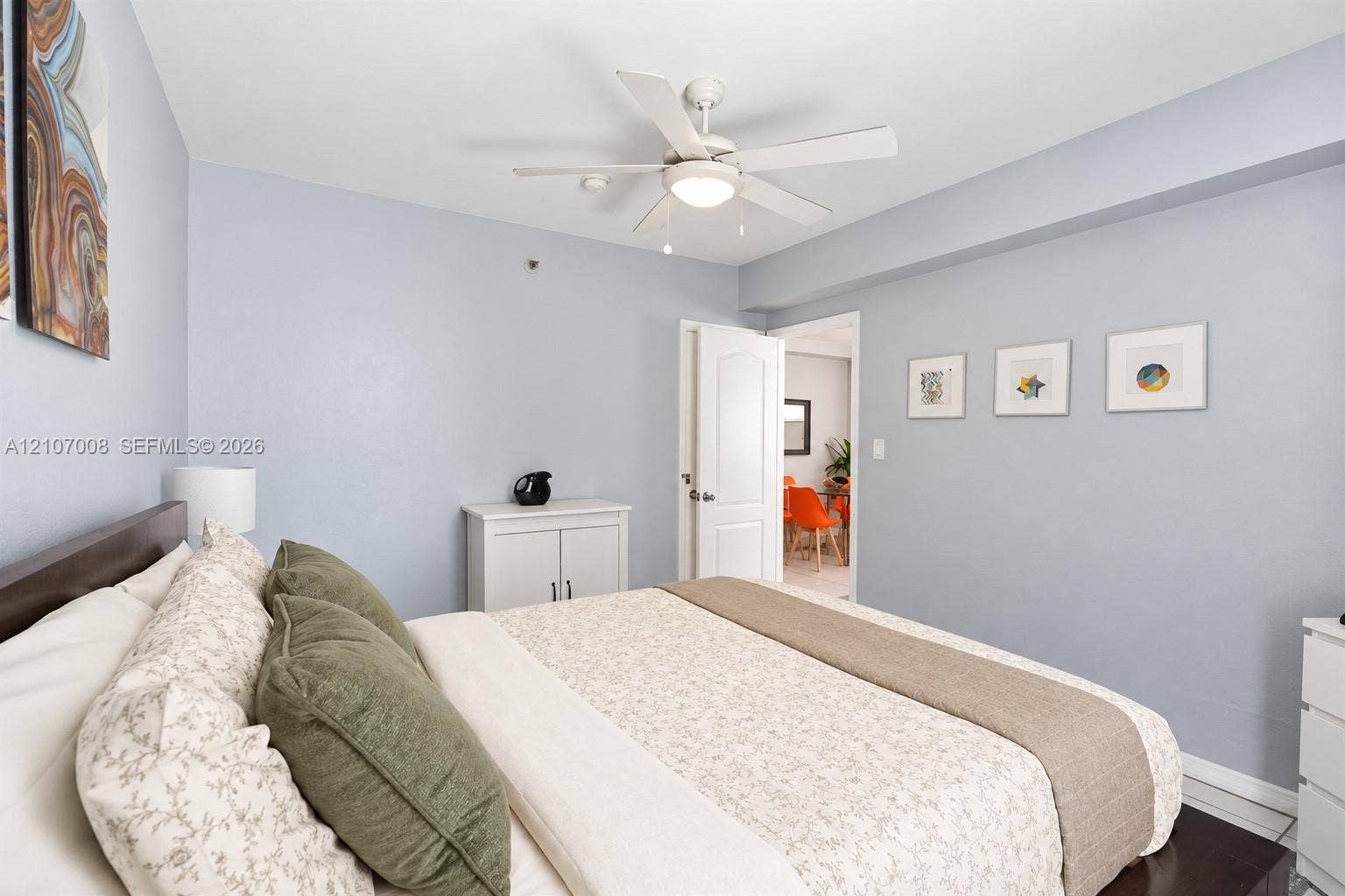 3030 Collins Avenue, #2H, Miami Beach, FL 33140 Room featuring a ceiling fan with integrated lighting and a multi-panel door