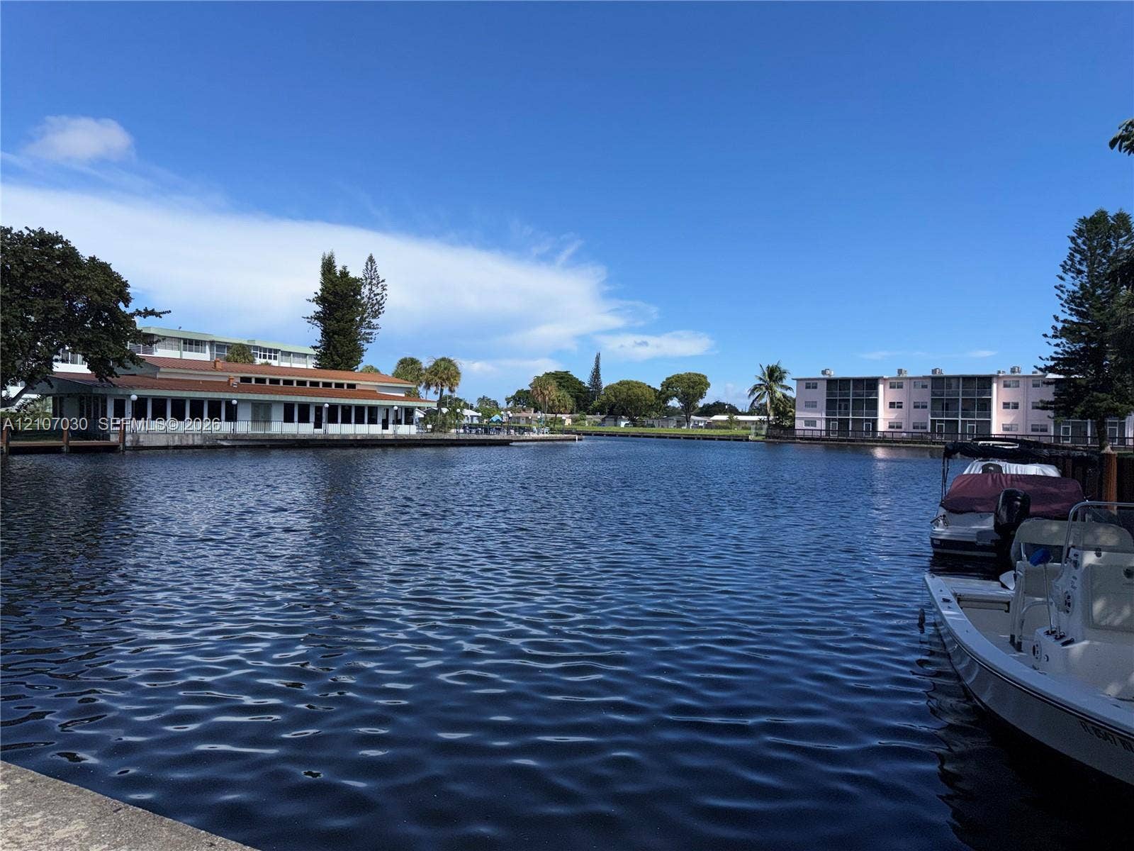 Waterfront locale featuring a concrete seawall, deep-water access, and space for boat docking