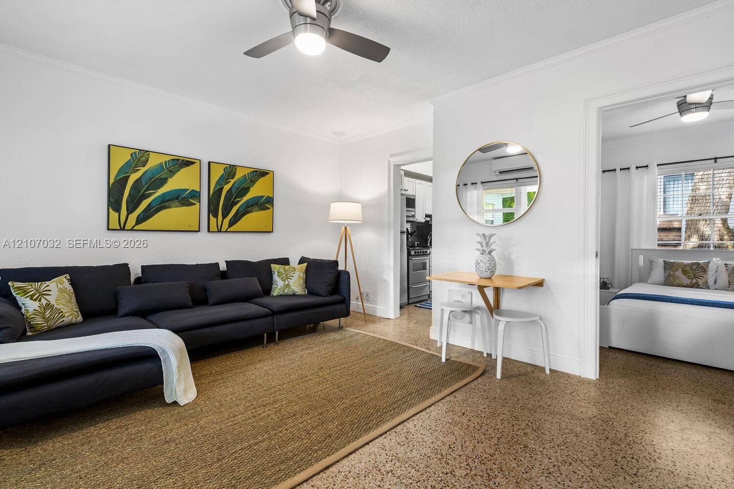 443 NE 17th Way, Fort Lauderdale, FL 33301 Interior space featuring polished terrazzo flooring, neutral wall finishes, and integrated ceiling fans
