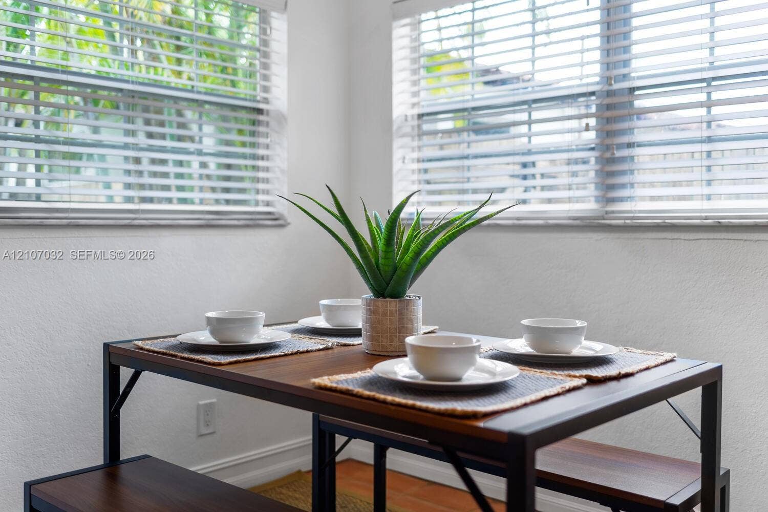 443 NE 17th Way, Fort Lauderdale, FL 33301 Dual windows featuring horizontal blinds and wood-finish flooring