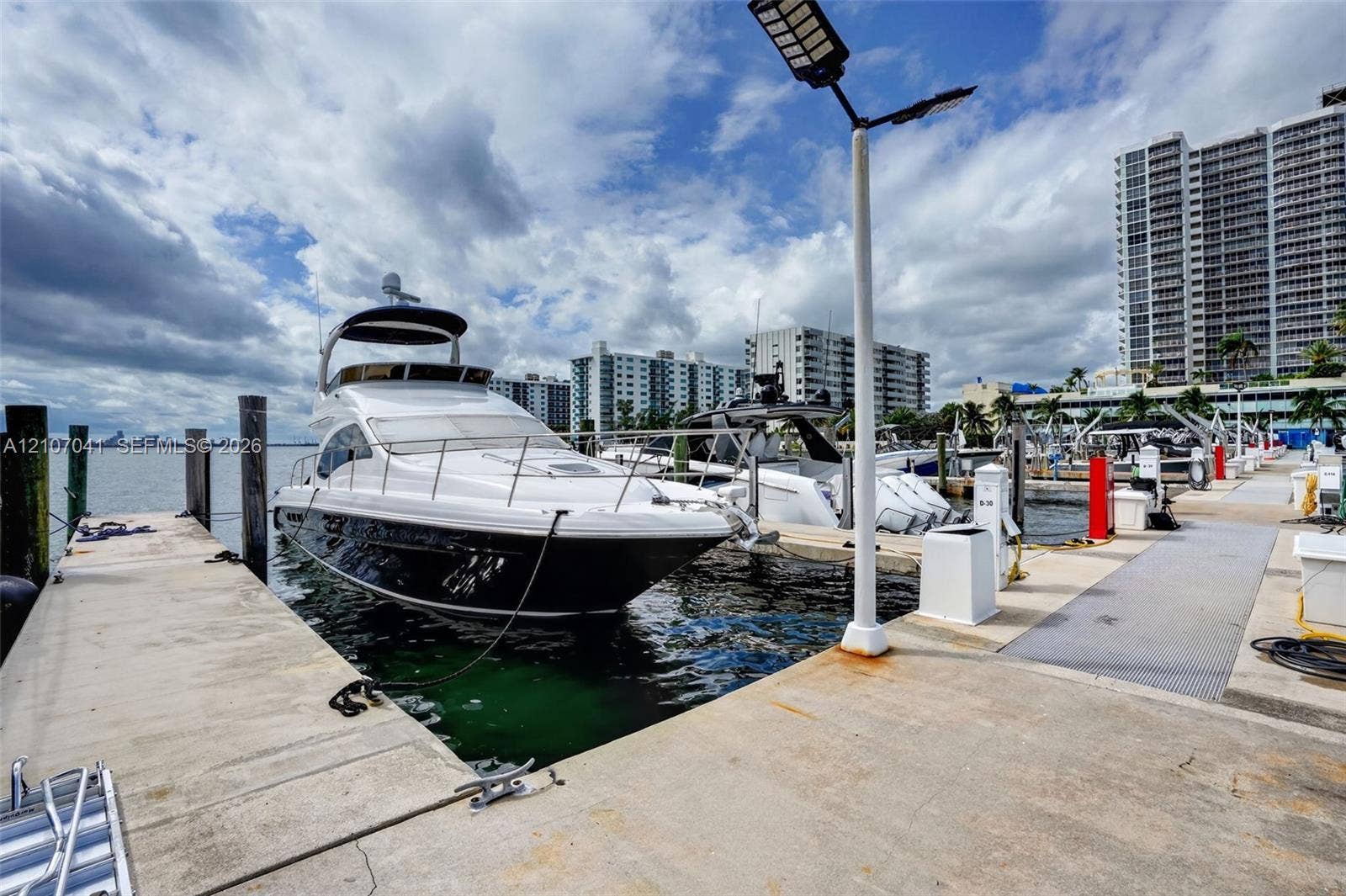Concrete deep-water boat slip featuring utility pedestals and integrated pole lighting