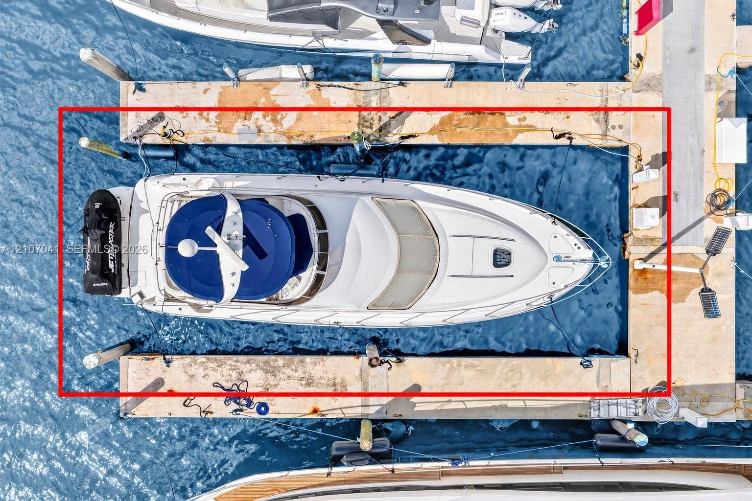 Private concrete boat slip featuring deep-water access, mooring cleats, and dedicated pilings