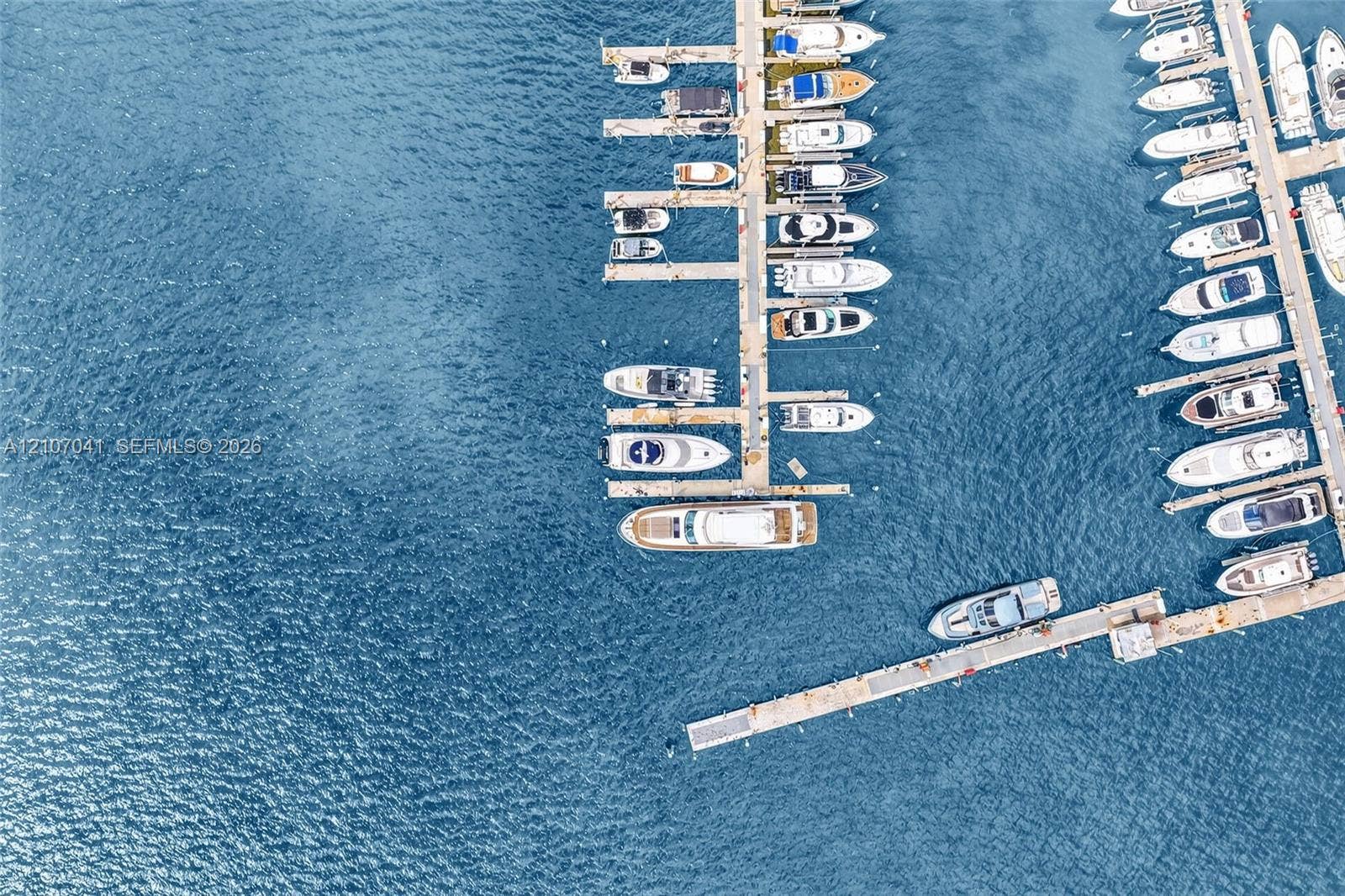 Deep-water marina featuring multi-vessel docking slips and concrete pier infrastructure
