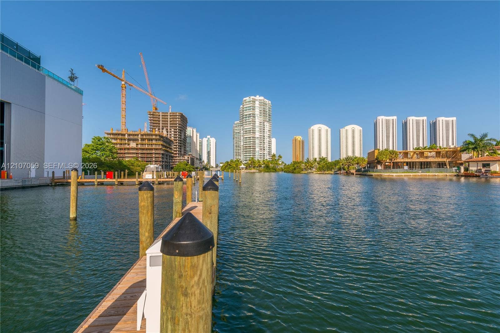 400 Sunny Isles Boulevard, #121, Sunny Isles Beach, FL 33160 Deep-water dockage featuring wooden pilings and a direct waterway bulkhead