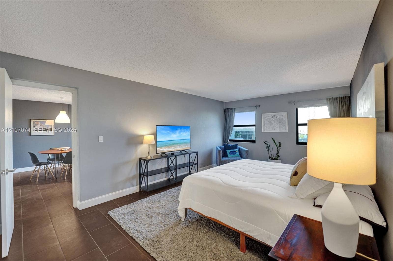 1201 S Ocean Drive, #218N, Hollywood, Hollywood, FL 33019 Spacious room featuring neutral wall tones, large windows, and tile flooring