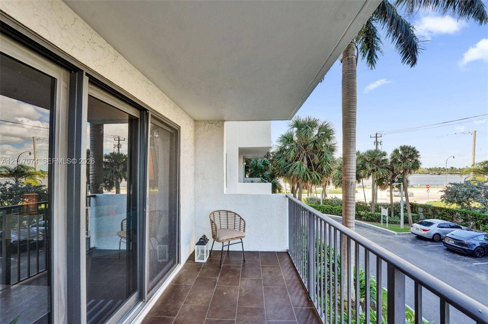 1201 S Ocean Drive, #218N, Hollywood, Hollywood, FL 33019 Covered balcony featuring tile flooring, metal railings, and sliding glass door access