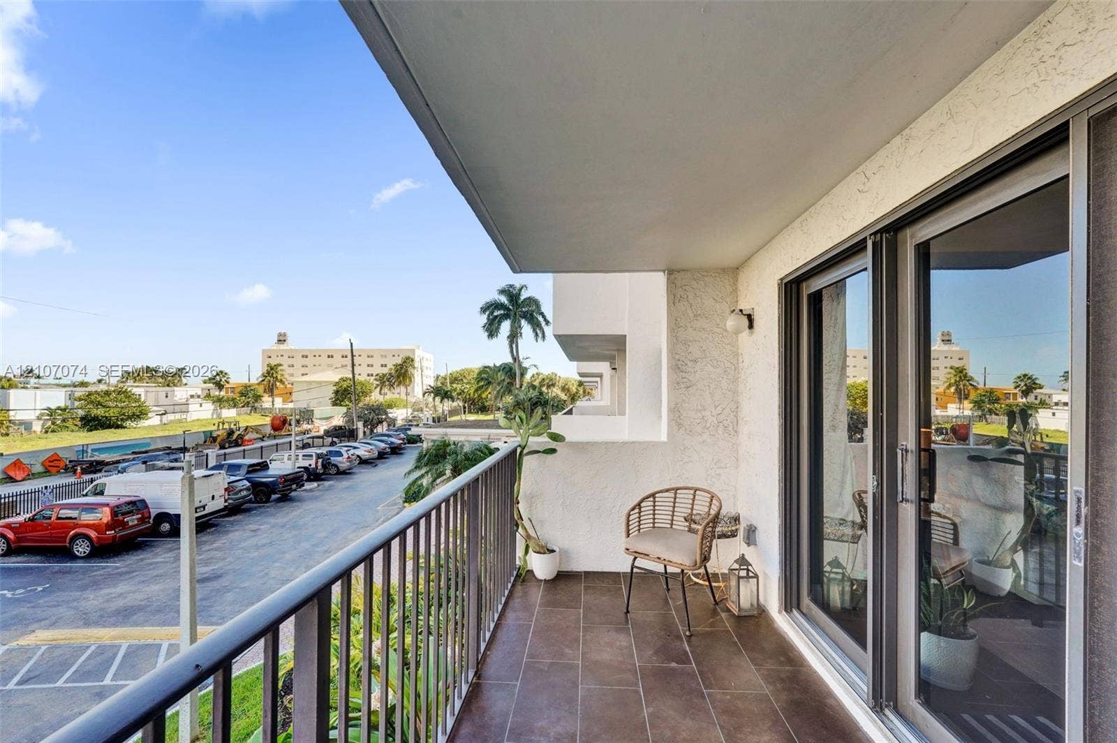1201 S Ocean Drive, #218N, Hollywood, Hollywood, FL 33019 Covered balcony featuring tile flooring, metal railing, and floor-to-ceiling glass sliding doors