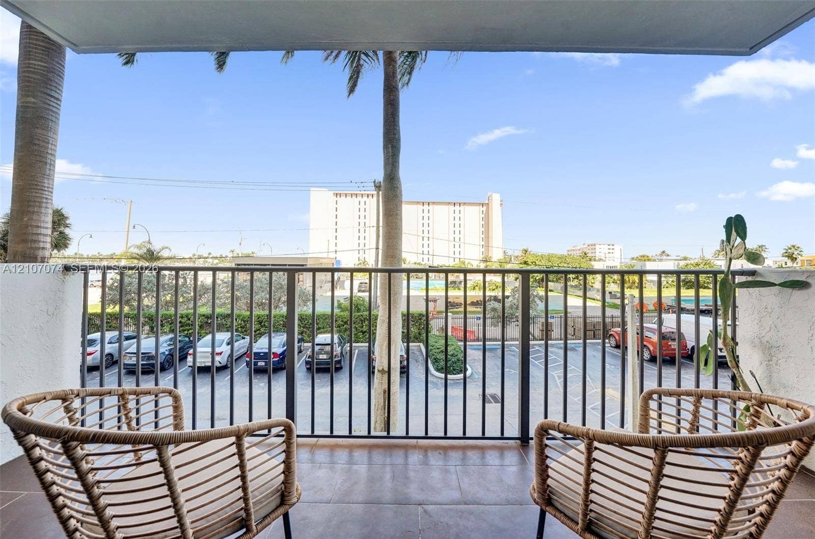1201 S Ocean Drive, #218N, Hollywood, Hollywood, FL 33019 Covered balcony featuring tile flooring and a black metal railing