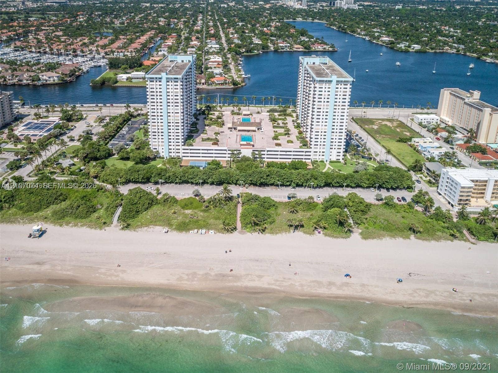 1201 S Ocean Drive, #218N, Hollywood, Hollywood, FL 33019 High-rise residential complex featuring oceanfront access, dual outdoor swimming pools, landscaped grounds, and paved parking