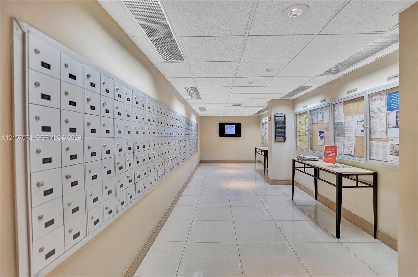 1201 S Ocean Drive, #218N, Hollywood, Hollywood, FL 33019 Communal mail area featuring high-capacity metal mailboxes, polished tile flooring, recessed lighting, and wall-mounted display boards