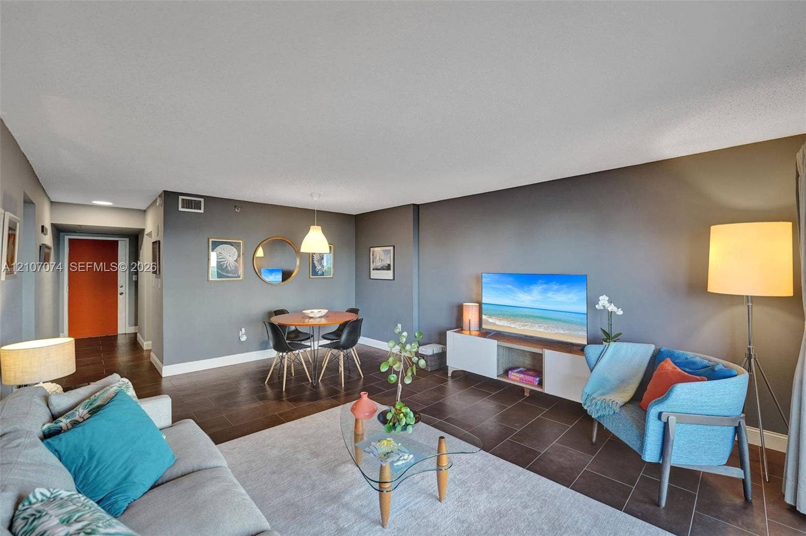 1201 S Ocean Drive, #218N, Hollywood, Hollywood, FL 33019 Open-concept living space featuring large-format tile flooring and a suspended pendant light fixture