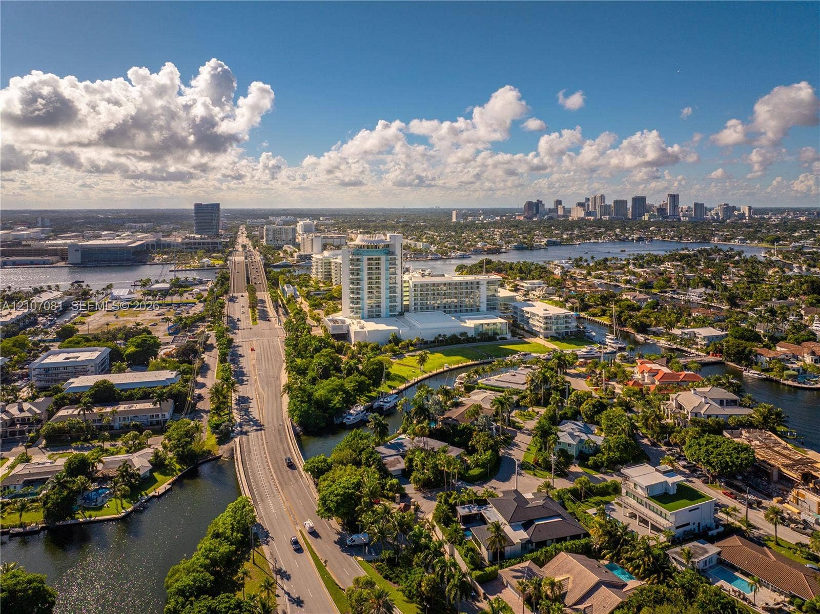 Aerial perspective showcasing proximity to coastal waterways and urban skyline