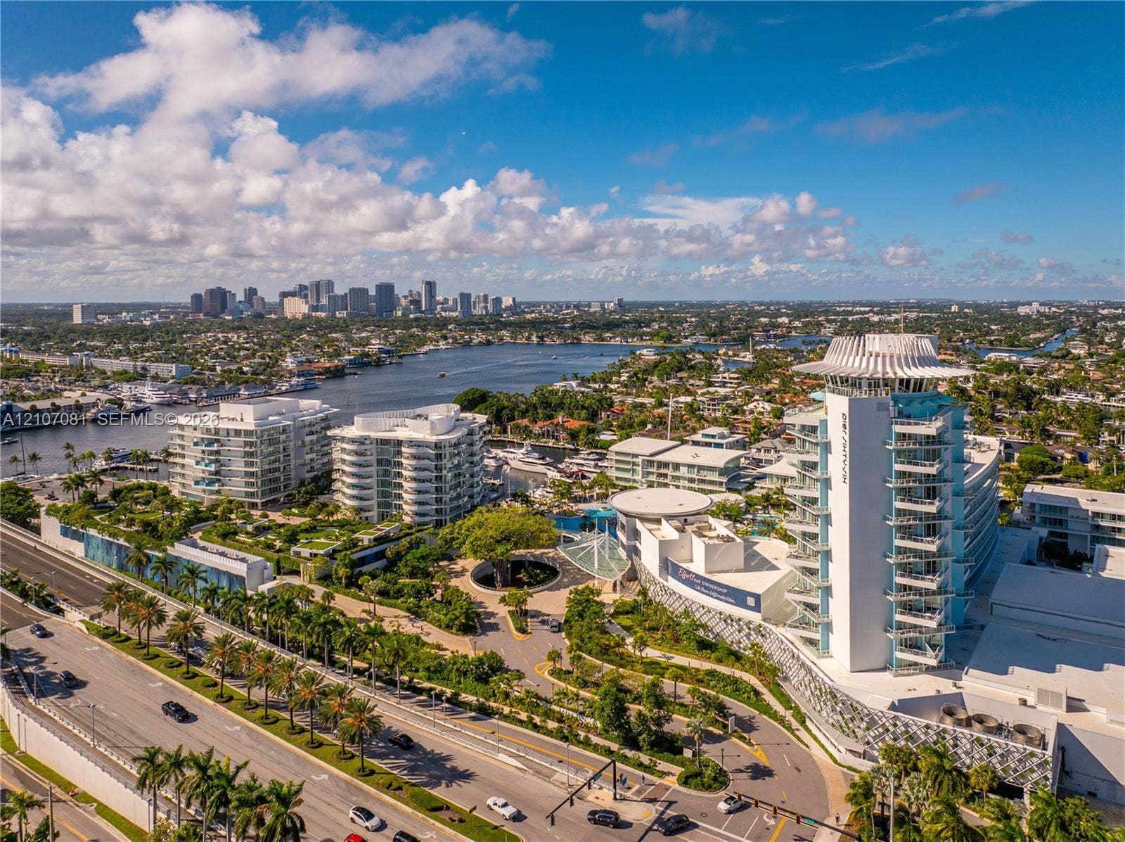 Aerial perspective featuring mid-rise coastal architecture, expansive landscaped grounds, integrated hardscaping, and proximity to the Intracoastal Waterway