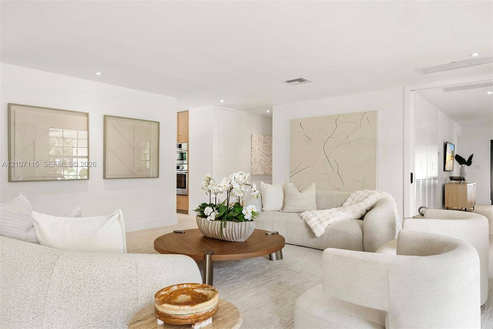 Open floor plan featuring recessed lighting, smooth-finish ceilings, and light-toned flooring