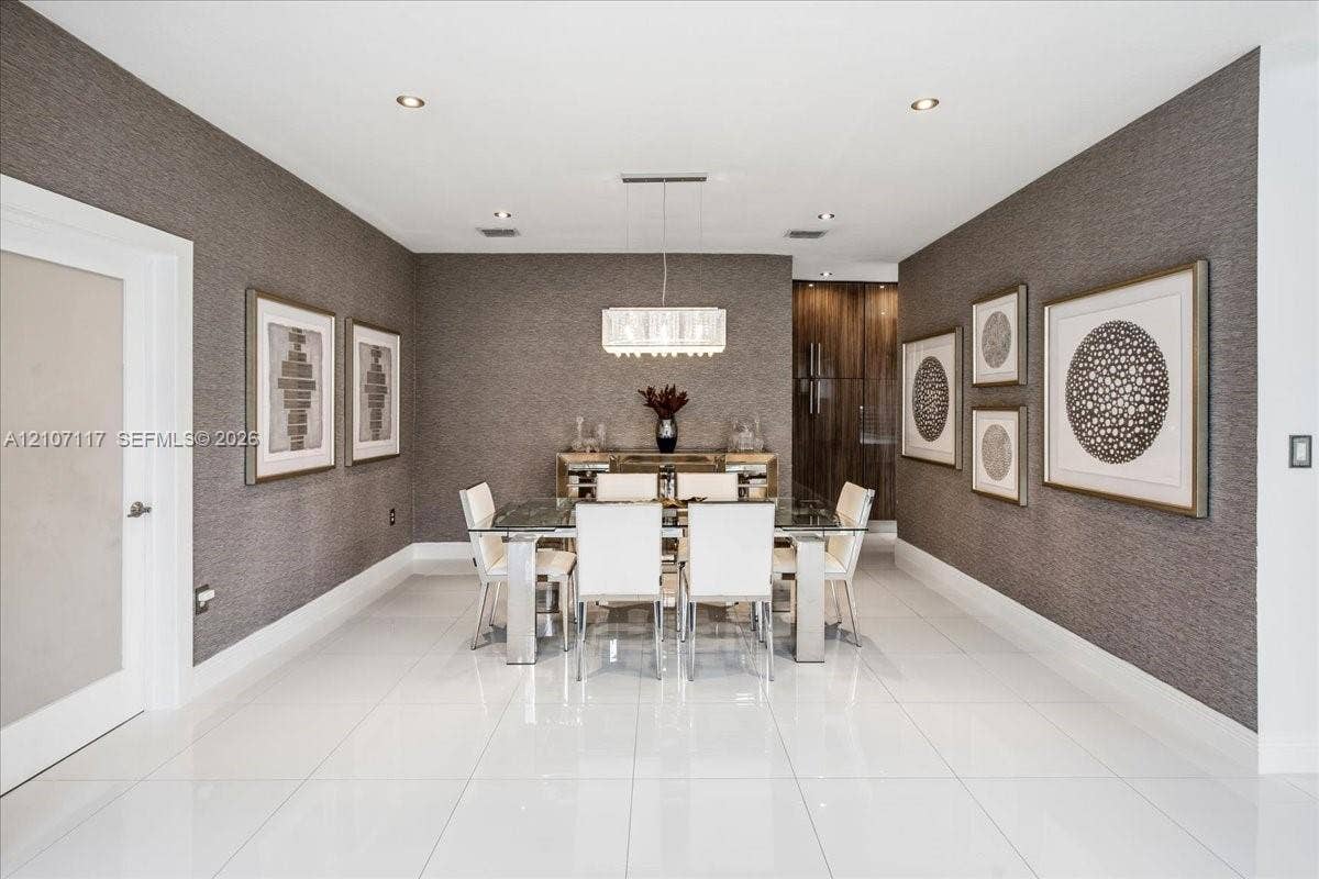 7863 NW 111th Court, Doral, FL 33178 Large-format tile flooring, textured wall coverings, rectangular multi-tier chandelier, and recessed lighting