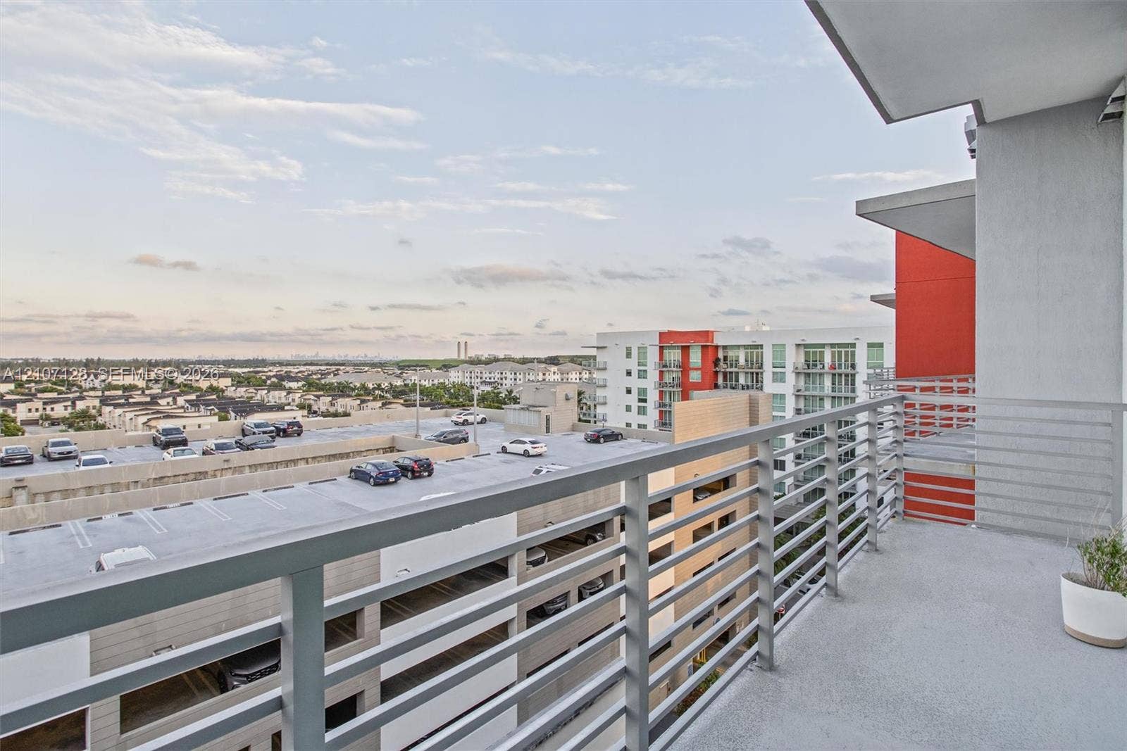 7875 NW 107th Avenue, #802, Doral, Doral, FL 33178 Private balcony featuring a concrete floor and a horizontal metal rail system