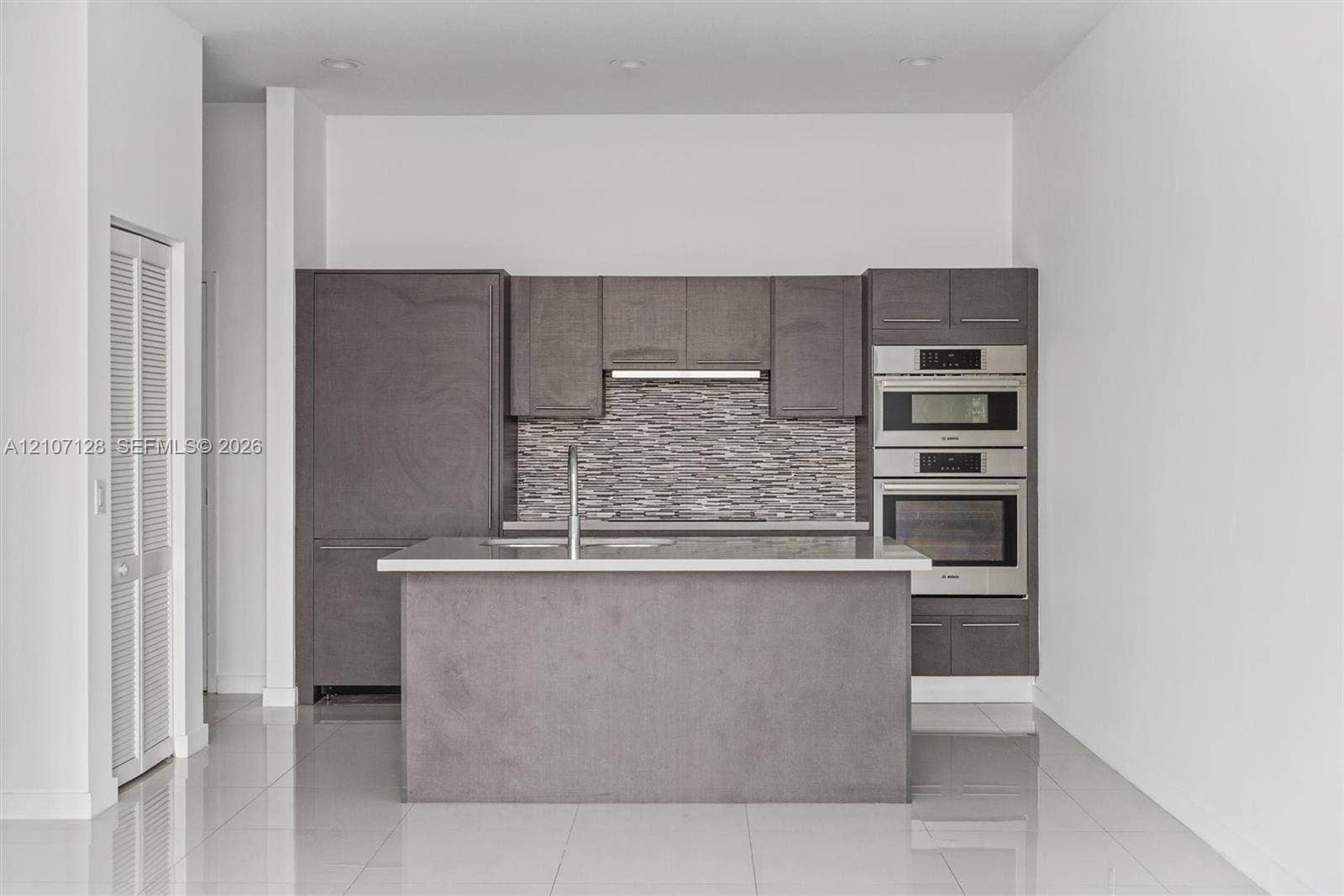 7875 NW 107th Avenue, #802, Doral, Doral, FL 33178 Modern kitchen viewed from the living area.