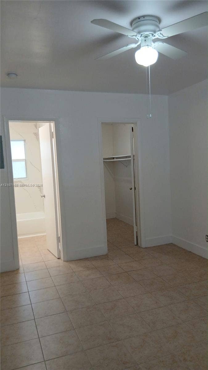 325 NE 2nd Street, #2, Hallandale Beach, Hallandale Beach, FL 33009 Ceramic tile flooring, ceiling fan with integrated lighting, reach-in closet with built-in shelving, and entry to bathroom