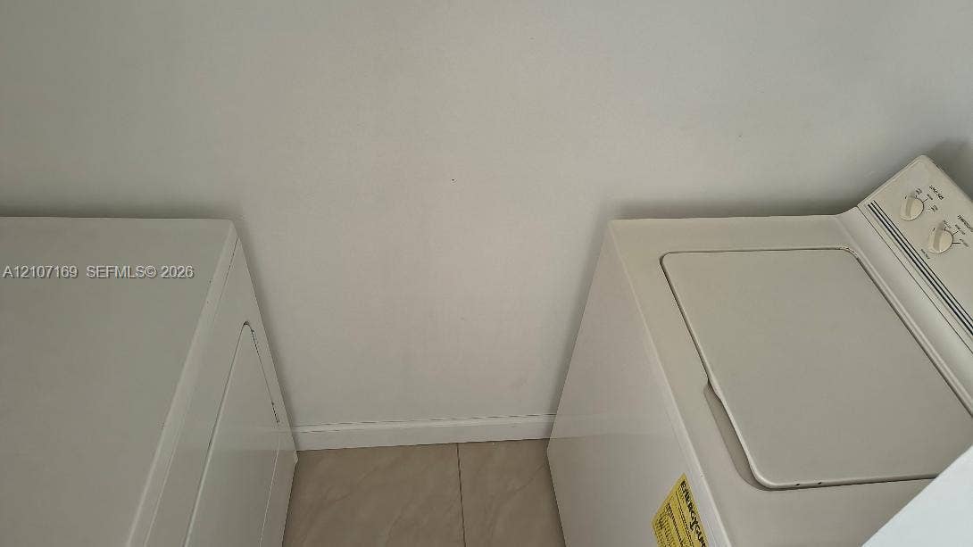1267 SW 46th Avenue, #2311, Pompano Beach, Pompano Beach, FL 33069 Dedicated laundry area featuring tile flooring and white wall finishes