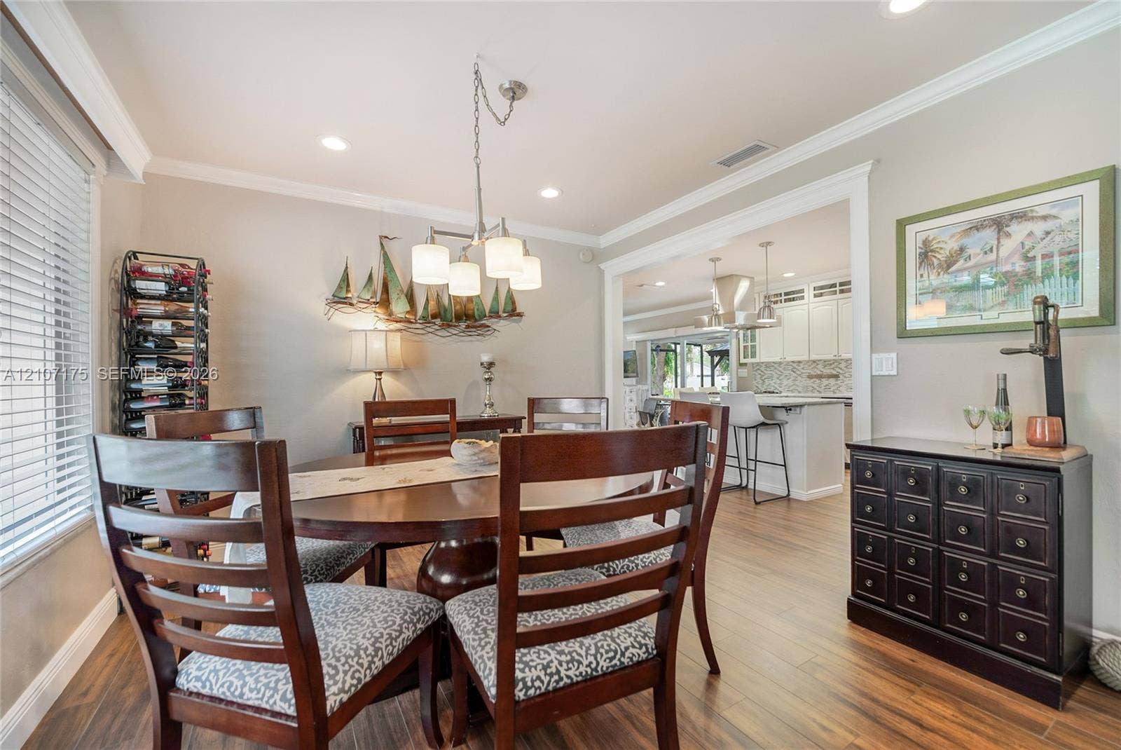 17550 SW 86th Avenue, Palmetto Bay, FL 33157 Dining space continues with wood-finish tile flooring, crown molding, and recessed lighting.