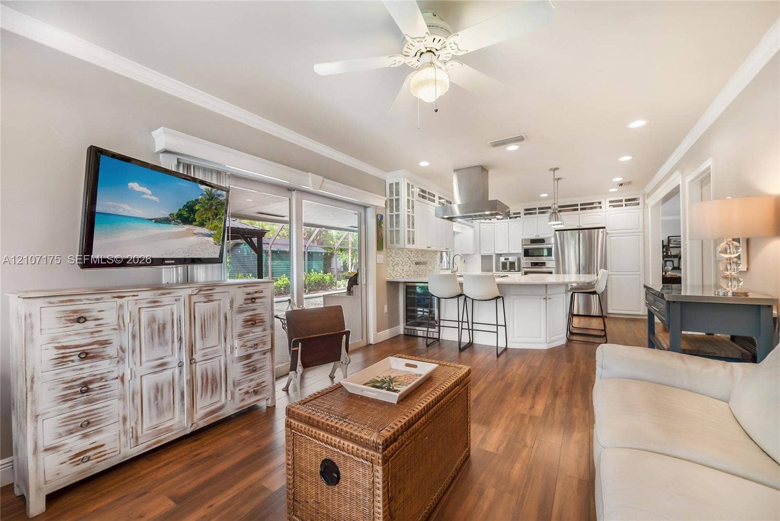 17550 SW 86th Avenue, Palmetto Bay, FL 33157 Open-concept kitchen family room with built-in wine cooler.