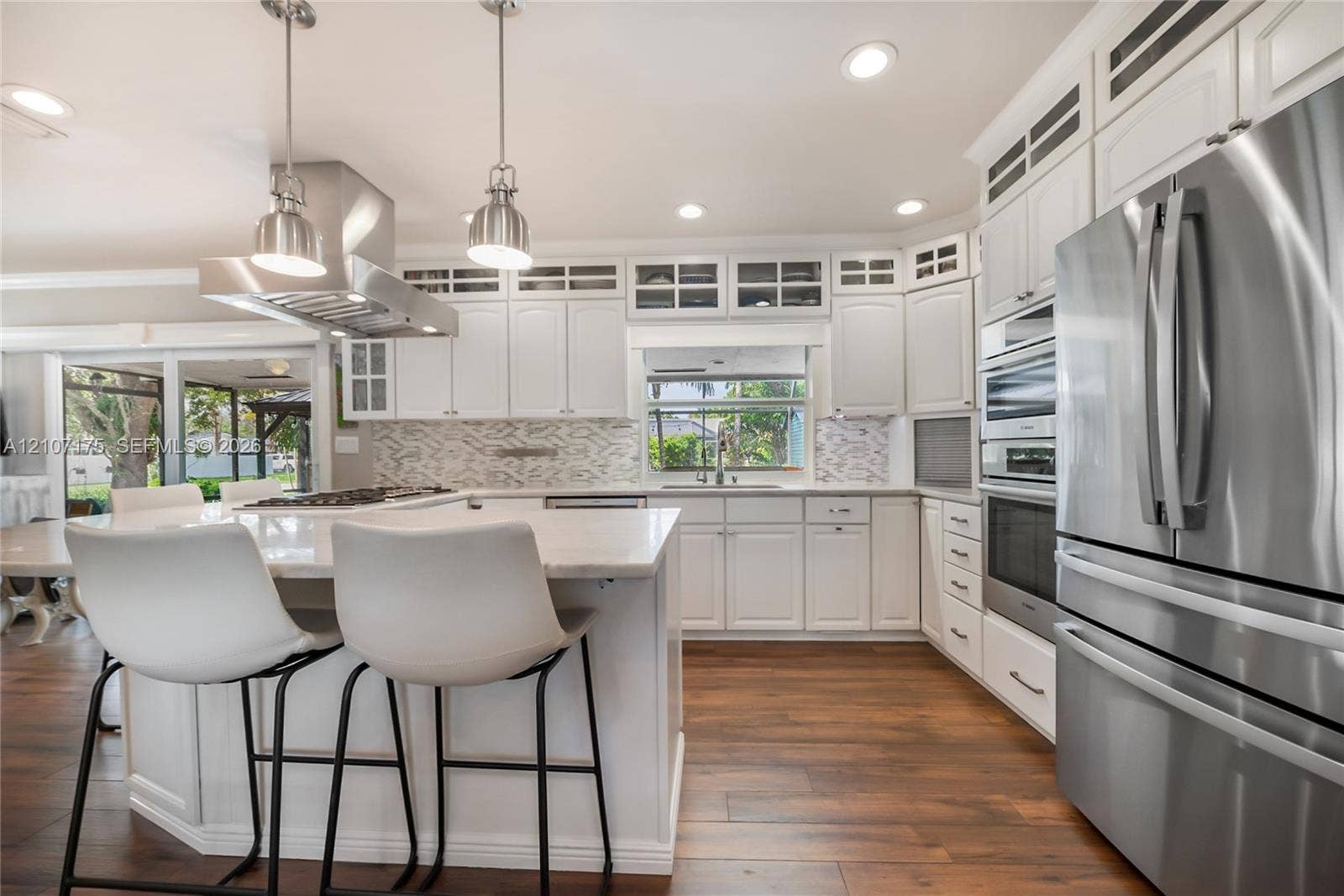 17550 SW 86th Avenue, Palmetto Bay, FL 33157 Professional grade stainless steel hood, gas stovetop and Bosch appliances.