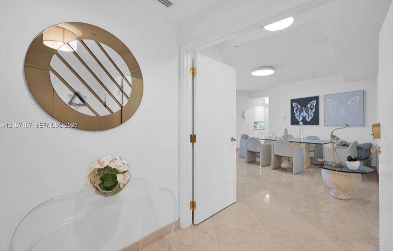 9601 Collins Avenue, #403, Bal Harbour, FL 33154 Polished stone tile flooring, neutral wall finishes, and flush-mount ceiling lighting