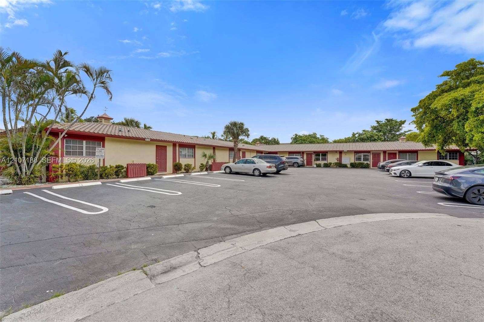 10301 NW 36th Street, #2, Coral Springs, Coral Springs, FL 33065 Single-story exterior featuring a tile roof, stucco siding, and dedicated surface parking